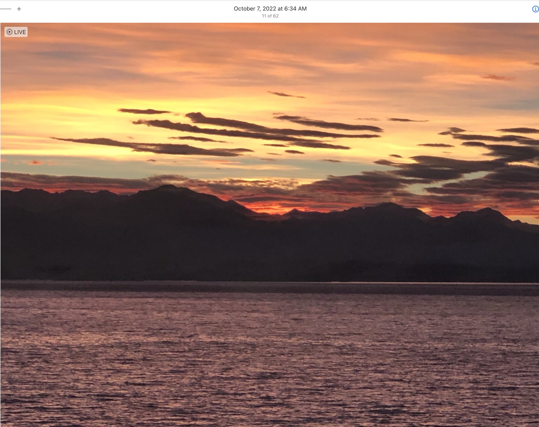 Pink and orange morning sky above a Mediterranean island